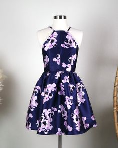 open back style floral fit and flare dress - watercolor floral prints with pockets that is fully lined. Lavender Dress For Spring Homecoming, Spring Homecoming Dress With Strappy Back, Spring Purple Floral Dress, Purple Floral Dress For Party, Purple Floral Print Dress With Spaghetti Straps, Fitted Purple Floral Dress For Garden Party, Purple Halter Neck Floral Print Dress, Purple Halter Neck Dress With Floral Print, Purple Floral Print Halter Neck Dress