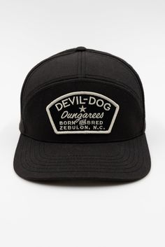 Details This updated 7-panel adjustable cap is made from 100% cotton and is dedicated to the spirit of being a born & bred DEVIL-DOG®. Black – Born & Bred patch 7-Panel with yoke, Structured 100% Cotton Crown Height: 3 ½”, Mid Profile Authentic Bandana branding inside crown Pre-curved bill provides all day comfort & shade Plastic Snapback Adjustable Closure Style# DDC114 Imported Cotton 5-panel Trucker Hat With Embroidered Logo, Cotton 5-panel Trucker Hat With Embroidered Patch, Cotton Trucker Hat With Flat Bill, Black Cotton 5-panel Trucker Hat, Trucker Style Cotton Baseball Cap With Logo Patch, Cotton 5-panel Hat With Logo Patch, Cotton Six-panel Trucker Hat With Logo Patch, Cotton Trucker Cap With Logo Patch, Cotton Trucker Hat 5-panel