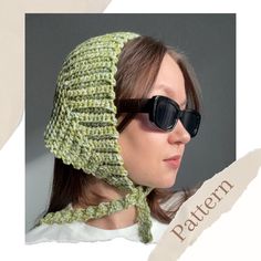 a woman wearing sunglasses and a knitted hat