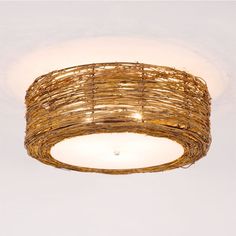 a wicker light fixture hanging from the ceiling