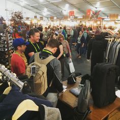 a group of people looking at items in a store