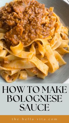 a white plate topped with pasta covered in sauce