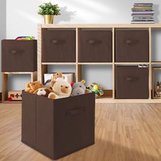 stuffed animals are sitting in a toy storage bin on the floor next to bookshelves