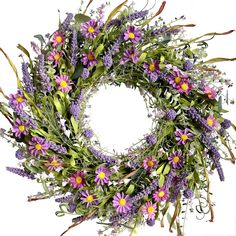 a wreath with purple flowers and green leaves