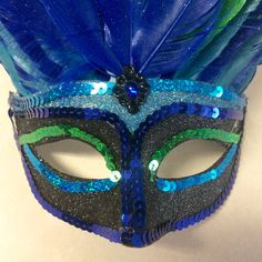 Peacock mask, peacock masquerade mask, mardi gras mask, half mask, peacock costume, gatsby party mask, masquerade party mask, feather mask Gorgeous glitter peacock mask adorned with blue and green feathers. Has an elastic band. Peacock Masquerade, Peacock Halloween Costume, Peacock Halloween, Masquerade Party Mask, Peacock Mask, Peacock Tutu, Peacock Skirt, Kid Costume, Peacock Costume