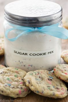 a jar filled with cookies sitting on top of a table