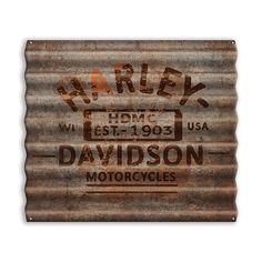 an old rusty metal sign advertising harley motorcycles