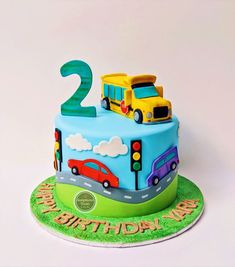 a two year old birthday cake with cars on it