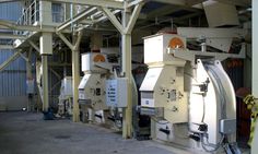 several machines are lined up in a warehouse