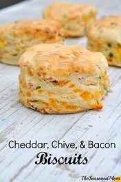 cheddar, chive, and bacon biscuits on a wooden table with text overlay