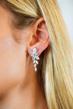 The LOLA earrings features petite clusters of marquis-cut diamond simulants. Perfect for special occasion such as wedding, bridesmaids and school formal or prom. Available in silver plate with clear stones. Cubic zirconia in silver plate with cubic zirconia drop Measurements: H3.7cm x W1.3cm Weight: 6g Please note: due to hygiene reasons, this product cannot be returned or exchanged unless faulty. Noodz Boutique, School Formal, Marquise Cut Diamond, Diamond Simulant, Clear Stone, Wedding Bridesmaids, Silver Plate, Diamond Cuts, Cubic Zirconia