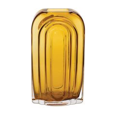 a yellow glass vase sitting on top of a table