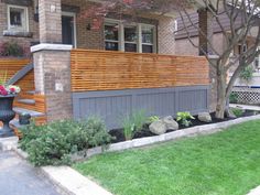 a wooden bench sitting in the middle of a yard