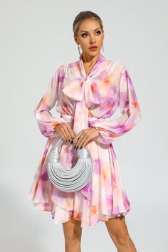 Embrace your inner fashionista with our Sid Pink Floral Mini Dress. This exquisite dress features a V-neck and long sleeves, perfect for any occasion. Its elegant design showcases a stunning floral print, adding a touch of femininity. Crafted from high-quality chiffon fabric, this short dress ensures both style and comfort.   Dress Length: Approx 92cm Materials: Polyester Gentle Dry Clean Only  The model is 5 ft 7 and wears size S  Color may vary due to lighting on images. The product images (wi Pink Floral Mini Dress, Dress Stylish, Elegant Designs, Floral Mini Dress, Product Images, Showcase Design, Chiffon Fabric, Stylish Dresses, Short Dress