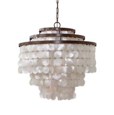 a chandelier with white beads hanging from the ceiling