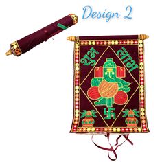 an embroidered banner with the words design 2 on it and a pen in front of it