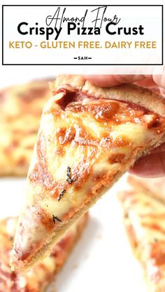 a close up of a person holding a slice of pizza in their hand with the text crispy pizza crust keto - gluten free dairy free