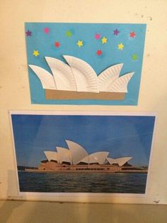 two pictures are hanging on the wall next to each other in front of a blue background