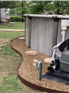 a water heater sitting in the middle of a yard