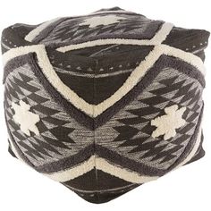 a black and white pillow with geometric designs on it