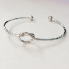 Awesome Silver Tone "Tie The Knot" Bangle Bracelet. These Are Adorable Bridesmaid Gifts Or Wear Them Yourself. I Recently Closed My Online Shop And Have Tons Of These In Gold, Silver, Black And Rose Gold. If You Don't See The Color Or Amount That You Need, Just Ask. These Are Adjustable And Can Fit Anywhere From A Child's Wrist To A Large Adult. (I Wouldn't Recommend For A Baby But Closed They Are Around A 4-5" Which Is Fine For A Little Flower Girl) Adjustable Silver Bangle For Bridesmaid Gift, Black And Rose Gold, Knot Bangle, Silver Tie, Jewelry Knots, Women's Tie, Tie The Knot, Bridesmaid Bracelet, Womens Tie