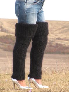 "HAND KNITTED GAITERS / LEG WARMERS ### DESIGNED & CREATED by Giorgio Qualitat ### Product Specification: § Color: Black; § Style: Ribbed hand knitted gaiters; § Material: 2 strands premium class longhair mohair; Size & Measurements: § Length: 41.3 \" / 105 cm § Circumference at the upper end: 20.5 '' / 52 cm § Circumference at the lower end: 9.4 '' / 24 cm § Net weight: 501 g All measurements are taken with the item laid flat and not stretched. The lady modeling has a circumference at thigh - 2 Tight Footless Leg Warmers For Winter, Fitted Black Knitted Leg Warmers, Fitted Full-length Black Leg Warmers, Cozy Black Thigh High Leg Warmers, Black One-size Warm Leg Warmers, Black Warm Leg Warmers One Size, Black Warm One-size Leg Warmers, Black One Size Leg Warmers, Cozy Hand Knitted Fitted Leg Warmers