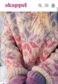 a close up of a child's hands wearing knitted mittens and sweaters