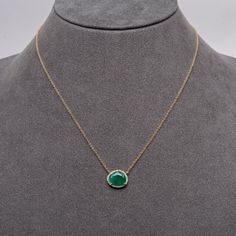 This is part of Chairish’s Fine Jewelry assortment.  If you are looking for a little bit of color to make you happy, this is your necklace. A perfect size emerald for every day that you won't want to take off. We like to layer ours with the sapphire crescent pendant of the oval link chain with diamond connector clasp.  14K Gold; .08 CT Diamonds; 2.35 Ct Emerald; 16 - 18 inches Emerald Pendant Necklace With Clavicle Chain, Fine Jewelry Green Oval Pendant Emerald Necklace, Gold-plated Round Emerald Necklace, Hand-set Round Emerald Necklace In Fine Jewelry Style, Yellow Gold-plated Emerald Necklace, Luxury Green Emerald Oval Pendant Necklace, Elegant Yellow Gold-plated Emerald Necklace, Emerald Color, Space Rock