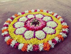 a circular arrangement of flowers on the ground