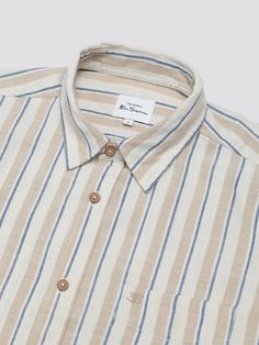 This mod stripe shirt features a curved hem and casual point collar. Made from 100% cotton, this classic fit shirt is completed with a ‘B’ embroidery on the chest pocket. 100% COTTON 40 DEGREE WASH WASH DARK COLORS SEPARATELY MEDIUM IRON Striped Shirt With Pockets And Spread Collar, Casual Shirt With Striped Spread Collar, Striped Cotton Shirt With Placket, Cotton Shirt With Striped Spread Collar, Stripe Shirt, Dark Colors, Striped Shirt, Mens Tees, Chest Pocket