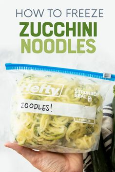 someone holding up a bag of zucchini noodles with the text how to freeze zucchini noodles