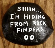 a rock with the words shh i'm hiding from rock finders written on it