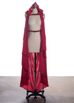 Mysterious, witchy harness belt made in thick, strong red PVC or red leather. A detachable hood and draped cape in lightweight, floaty gauze swirls around you for ghostly, wraith-like drama. Hood and cape attach separately at the shoulders with long gauze ties. Fit is adjustable with buckles and straps at waist, shoulders, and across chest.Silver-toned nickel plated steel hardware. Shown in translucent red PVC with red gauze cape and hood. Also available in red leather. Cape is designed to graze Witchy Looks, Red Drapes, Harness Belt, Gothic Accessories, Detachable Hood, Gothic Fashion, Custom Fit, Diy Clothes, Red Leather