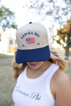 a woman wearing a hat with the words obama phi on it in blue and white