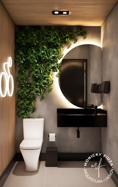 a bathroom with a toilet, mirror and plant on the wall in it's corner