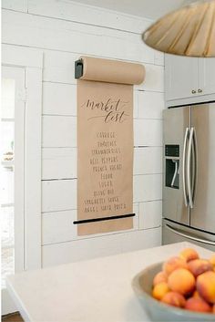 a roll of paper hanging on the wall in a kitchen