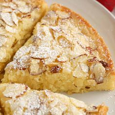 several pieces of pie on a plate with strawberries in the backgroung