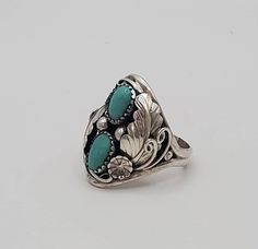 Fancy turquoise sterling silver statement ring.  This amazing ring is crafted in the dome style and is a multi-stone ring featuring stunning detail in the silver work.  This ring has gorgeous 925 sterling silver leaf design and two beautiful cabs of turquoise as its crowning jewel.  This statement piece would make a great gift for dad for a birthday, Valentines Day gift, anniversary or a great graduation or birthday gift!    I only have  few of these rings left, so PLEASE check with me on sizing before ordering!  Also, please check out my other listings in my Etsy shop to find necklaces, bracelets and earrings to compliment this piece. Turquoise Fine Jewelry Ring, Handmade Southwestern Style Ring Jewelry, Handmade Southwestern Style Ring, Heirloom Sterling Silver Open Ring, Southwestern Oval Jewelry For Jewelry Making, Adjustable Turquoise Open Ring For Wedding, Turquoise Hallmarked Jewelry For Gift, Adjustable Fine Jewelry Turquoise Ring, Elegant Handmade Silver Dome Ring