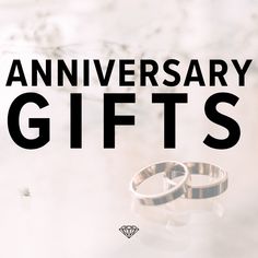 two wedding rings sitting on top of each other with the words anniversary gifts above them