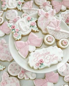 baby shower cookies with pink and white decorations