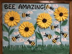 a bulletin board with bees and sunflowers on it