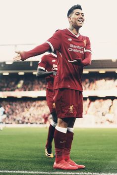 the soccer player is celebrating his goal on the field