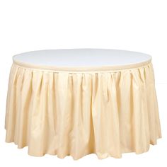 a round table with pleated skirting around it