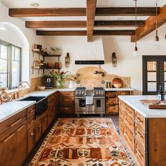 a kitchen with wooden cabinets and an area rug on the floor in front of it