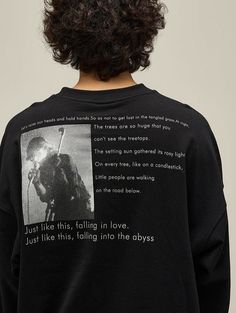 the back of a man's sweatshirt with an image of a person on it