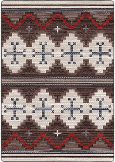 an old navajo rug with crosses on the front and back ends, in brown, white, and blue colors