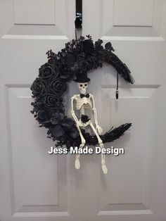 a skeleton wreath hanging on the front door