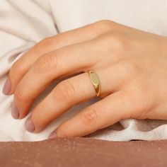 14k Solid Gold Tiny Signet Ring, Delicate Personalized Pinky Ring Women, Zodiac Monogram Engravable Gold Name Ring, Minimalist Custom Ring Details: Made to Order Band Width: 1.72 mm Top Width: 9.37 x 6.34 mm Thickness: 1.21 mm Gold Kt: 14K (also available in 10K and 18K) Available Gold Color: Rose Gold, Yellow Gold, White Gold All of our products are real solid gold Our products are NOT gold plated or vermeil. Engraving is possible for this item. This item is fashionable and elegant. It is thoug Dainty Gold Engraved Ring With Simple Design, Minimalist Engraved Yellow Gold Midi Rings, Minimalist Gold Engraved Midi Rings, Minimalist Engraved Gold Midi Rings, Gold Promise Rings, Gold Rings Stackable, Name Rings, Wedding Band, Tungsten Ring