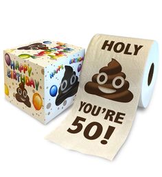 a roll of toilet paper next to a box with an emojt on it