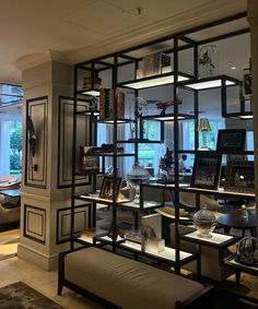 a living room filled with furniture and bookshelves